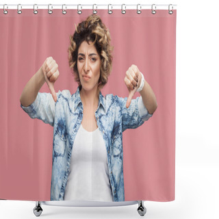 Personality  Sad Young Woman With Curly Hairstyle In Casual Blue Shirt Showing Thumbs Down And Looking At Camera With Dissatisfied Face On Pink Background Shower Curtains
