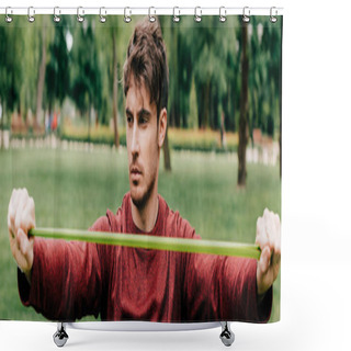 Personality  Panoramic Crop Of Sportsman Pulling Up Resistance Band In Park  Shower Curtains