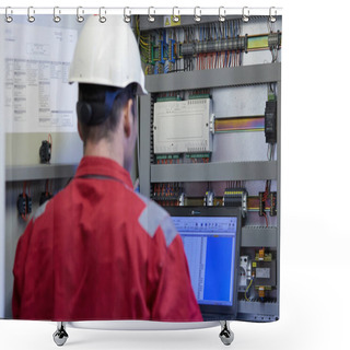 Personality  Energy Industry. A Technician Dressed In Red Overalls And A White Helmet Checking The Heating Parameters. Heating Water Distribution Technology. Service Work In The Power Industry. Heating Season. Shower Curtains