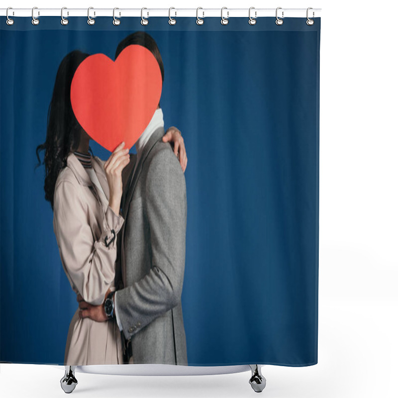 Personality  couple covering faces with heart shaped piece of paper isolated on blue shower curtains