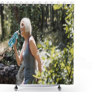 Personality  Smiling Senior Sportswoman Holding Sports Bottle With Water Near Stone In Forest  Shower Curtains