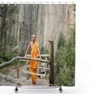 Personality  Buddhist In Orange Kasaya Standing On Wooden Walkway Near Rocks And Looking Away Shower Curtains