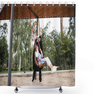 Personality  Cheerful Muslim Mother In Hijab Standing Near Daughter On Swing In Park  Shower Curtains