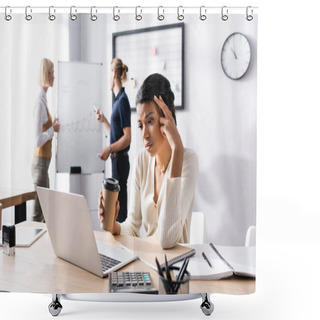 Personality  Tired African American Woman With Paper Cup Looking At Laptop At Workplace With Blurred Office Workers On Background Shower Curtains