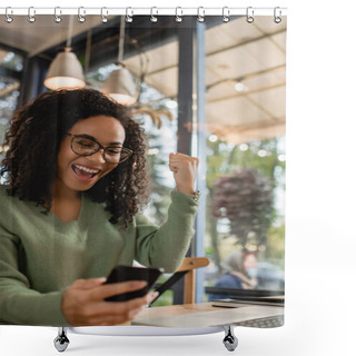 Personality  Excited African American Woman In Glasses Looking At Smartphone On Blurred Foreground  Shower Curtains