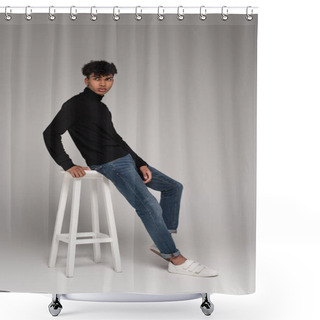 Personality  Full Length Of African American Young Man In Turtleneck Sweater Leaning On White Chair On Grey Shower Curtains