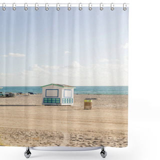 Personality  A Lifeguard Hut Stands Tall On A Sandy Beach Near The Ocean, Offering Protection And Assistance To Beachgoers. Shower Curtains