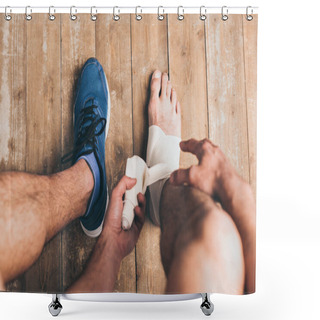 Personality  Cropped View Of Sportsman In One Sneaker Bandaging Injured Leg With Elastic Bandage Shower Curtains